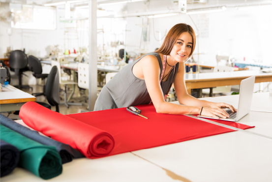 a person with fabric material on a table